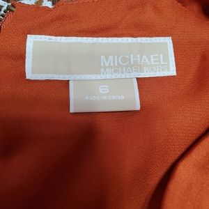 Orange sleeveless blouse